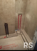 Укладка утеплителя под теплый пол, штробление стен под водопровод и канализацию.