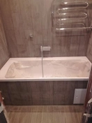 Произведен полный ремонт ванной и туалета. Включает демонтаж, замену сантехники, укладку плитки, отделку. Использованы высококачественные материалы и профессиональные инструменты.