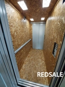 Зашивка лифта фанерой, защита лифта при строительстве.