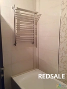 Фиксация полотенцесушителя и подключение  к системе отопления и проверка работоспособности.