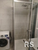 Укладка плитки с изготовлением душевого поддона.