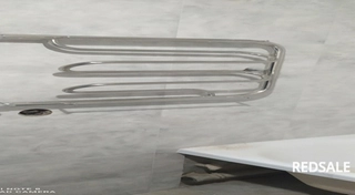 Произведена установка полотенцесушителя с предварительным штраблением канала для скрытия труб в стене.