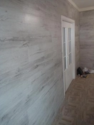 Отделка стен ламинированными панелями в квартире. 