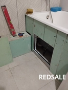 Экран из гипсокартона со встроенным люком для последующей укладки кафеля.